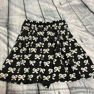 Tea Collection pleated jersey skirt black bows size 8